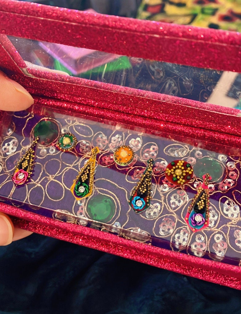Handmade colorful marigold Jungle Bindis or nail art with gold beads and velvet face and body stickers