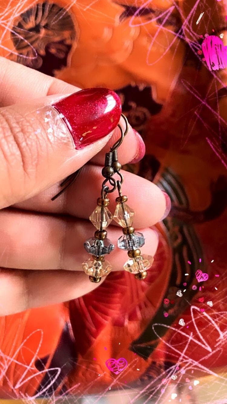Minimalist handmade embellished dainty sparkly mini dangly bead earrings in grey blue and clear beads with bronze